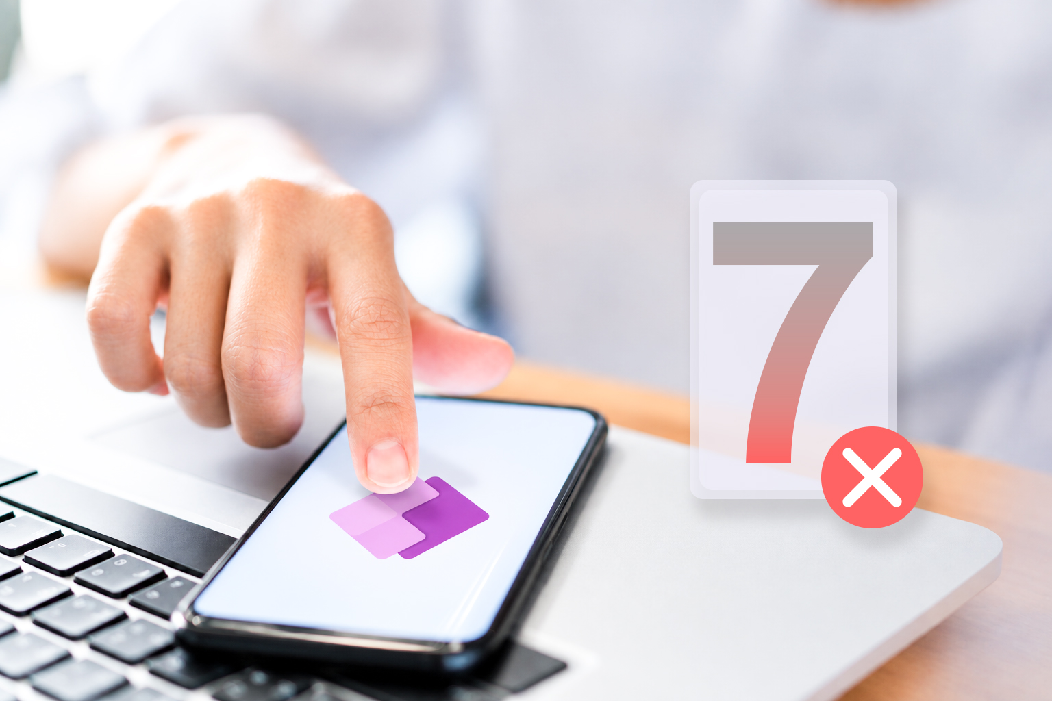 Microsoft Power Apps on a smartphone with a symbol representing seven implementation mistakes